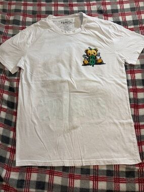 Miken White T‑Shirt with Yellow Bear and Green Dollar Graphic